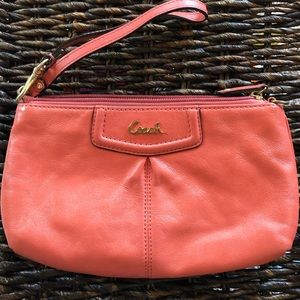 COACH pinkish-salmony clutch